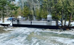 Ornamental driveway gate installed on carriages