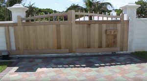 Wooden cantilever gate with arched top in Bermuda