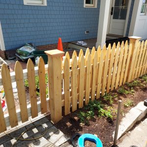 wood sliding gate and matching fence