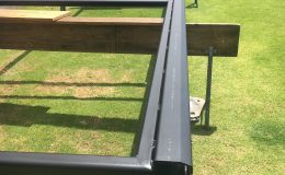 Frame built and welded to track and then powder coated