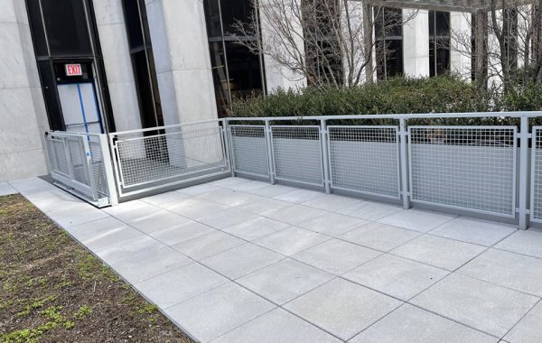Lightweight sliding gate and matching fence in Office Courtyard