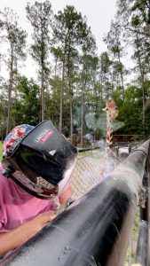 welding the gate frame with an onlooker