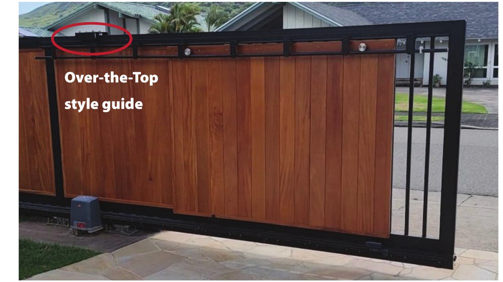 Photo of a wood slat privacy gate with an over-the-top guide painted black to blend in with the gate frame